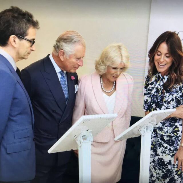 Valerio Li at a YOOX NET-A-PORTER royal visit with King Charles III and Queen Camilla